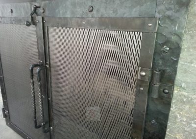 Fireplace door with panel detail