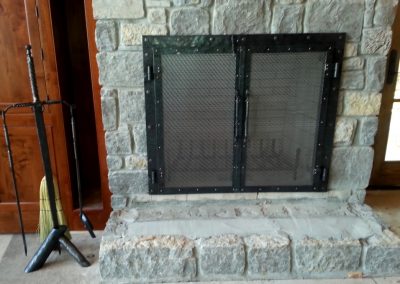 Fireplace doors with sword stand